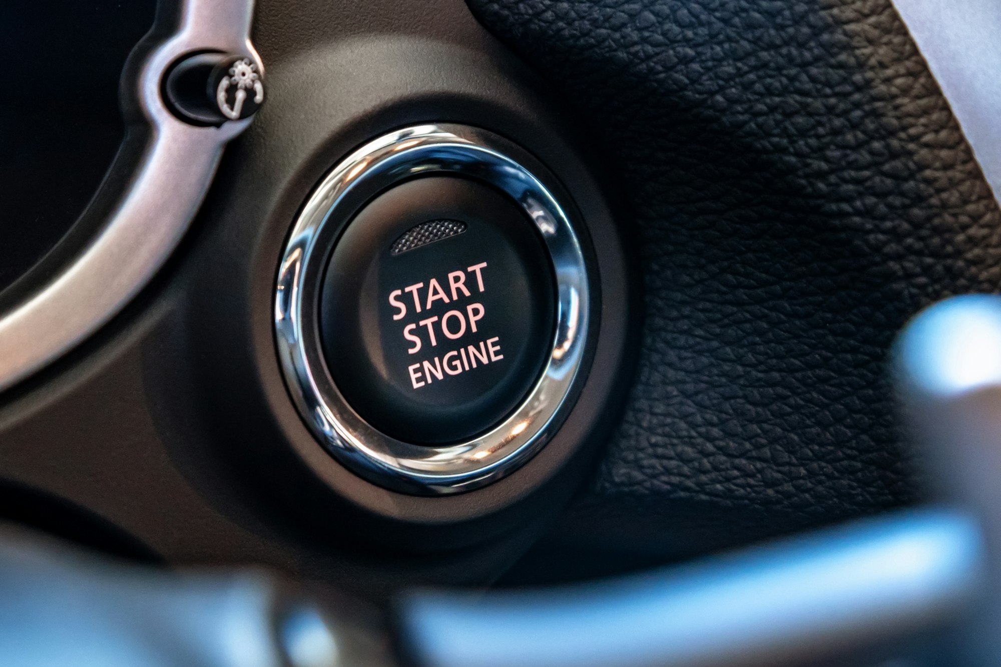 Engine start stop button in modern car close