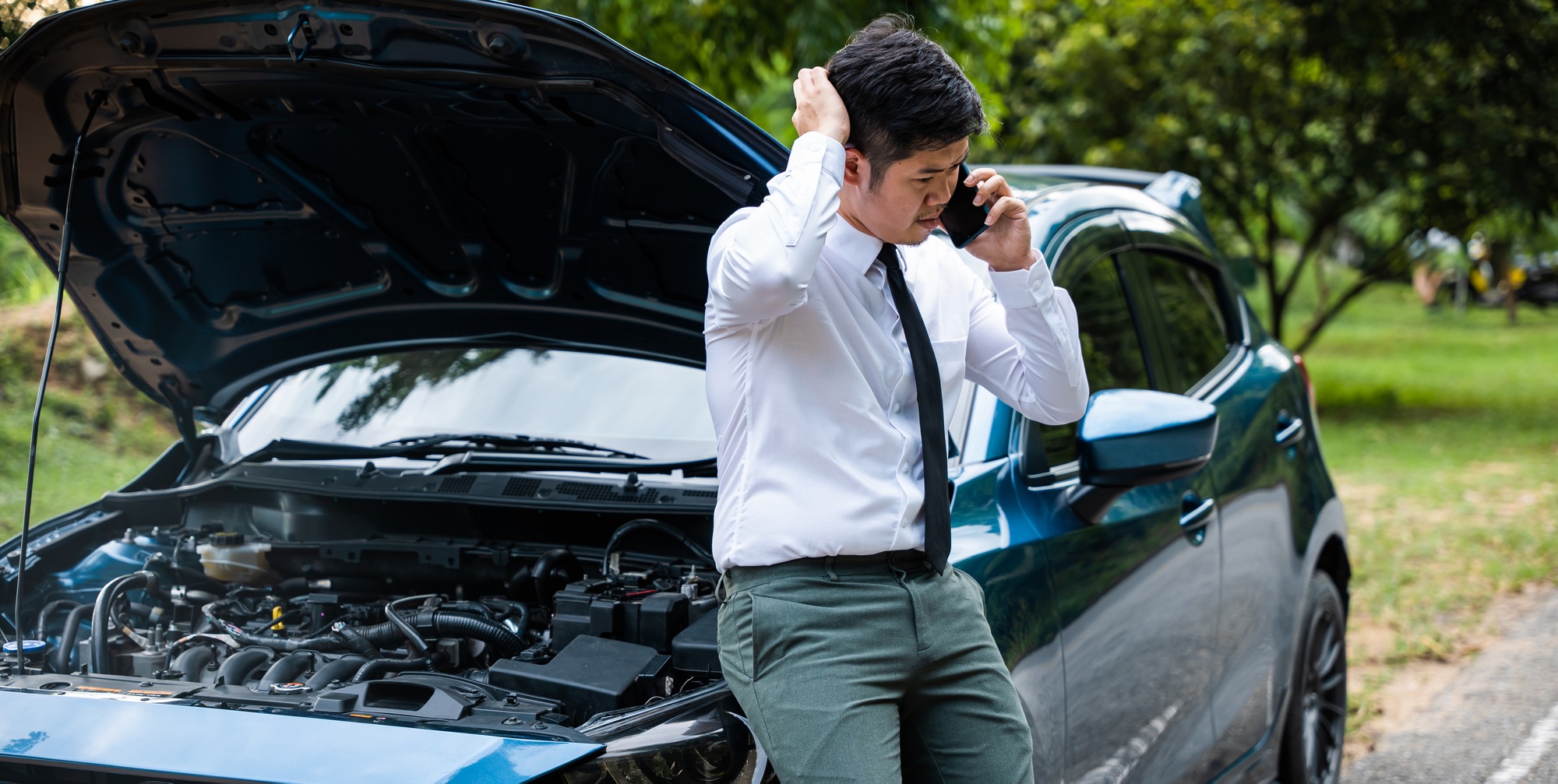 man calling for roadside assistance