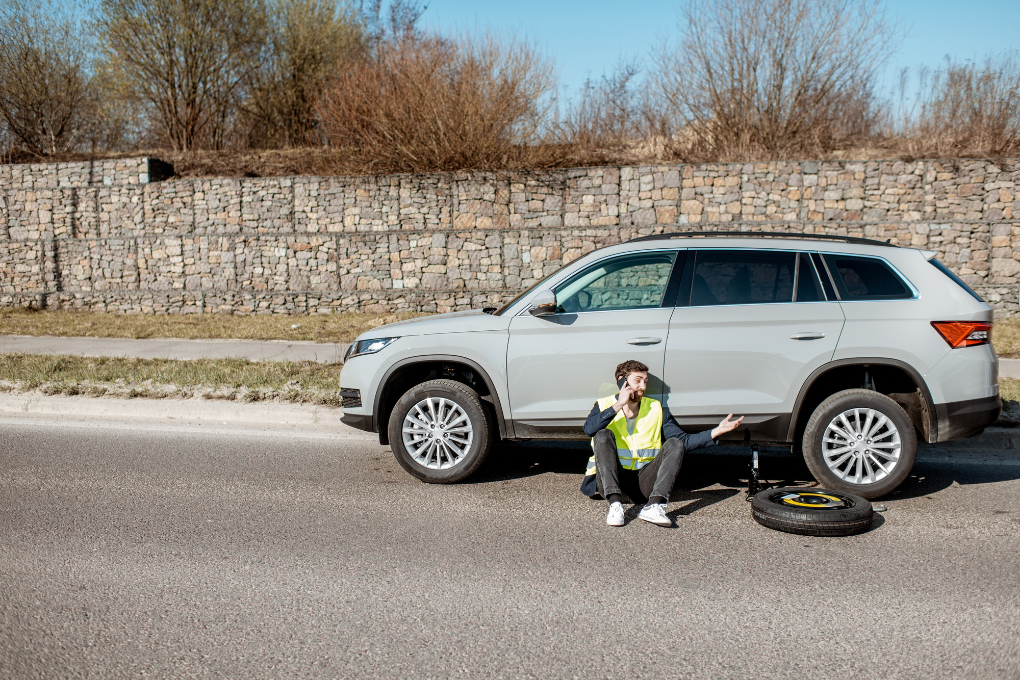 Man near the car on the roadside