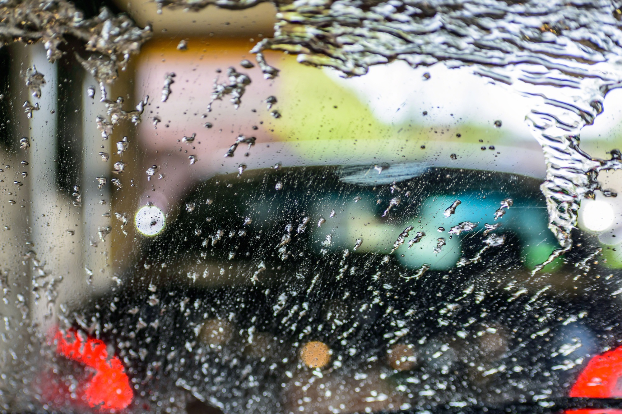 Water spraying the windshield at the car wash